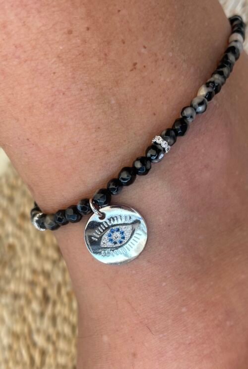 צמיד רגל חרוזים שחורים בשילוב עין עגולה