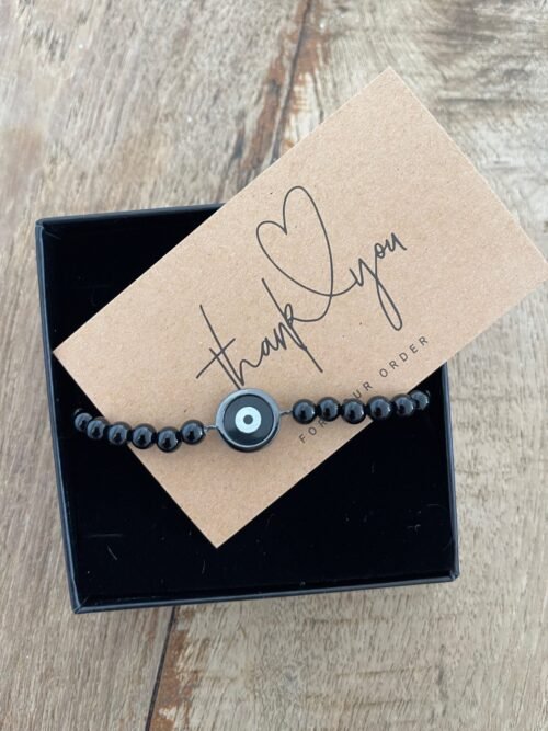 צמיד גבר חרוזים שחורים עם עין עיגול שחורה